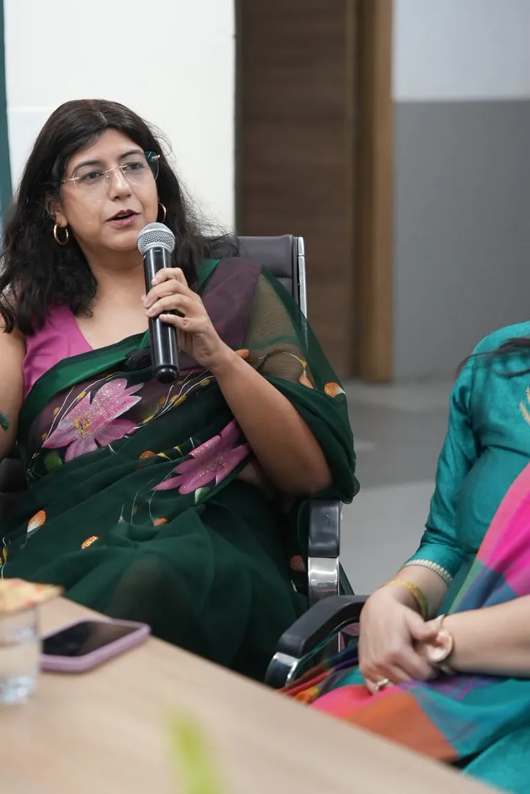 Dr Tarang Jain Arora speaking at a panel event.